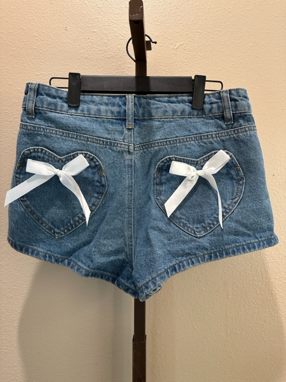Edikted Mid-Rise Blue Denim Jean Shorts with white bows